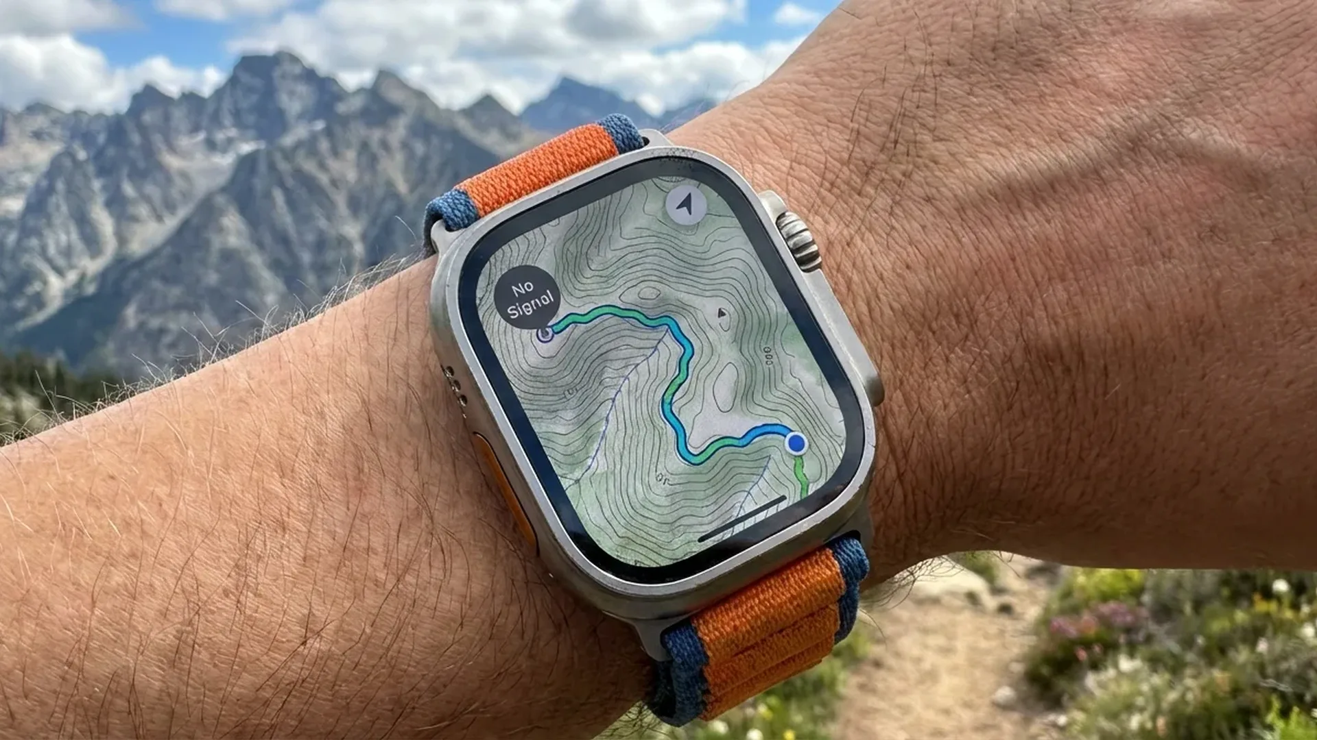 Apple Watch displaying offline maps interface with turn-by-turn navigation in mountainous terrain